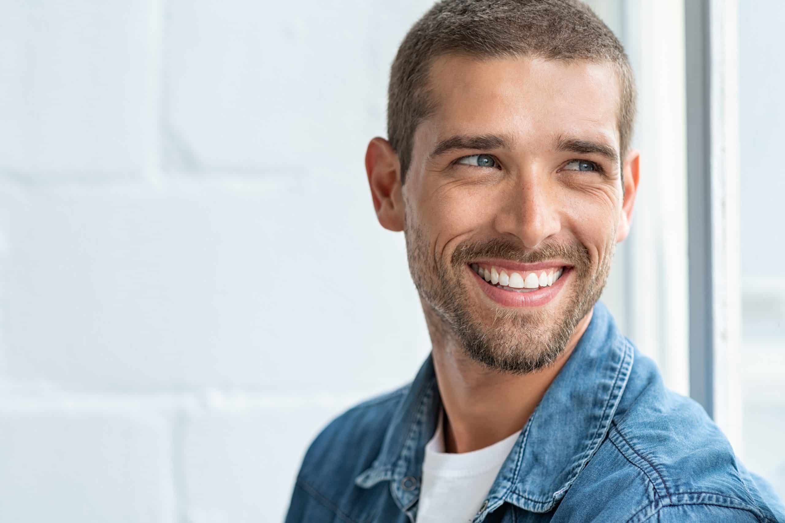 Close up of male patient looking away and smiling