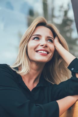 Female patient smiling and looking upward